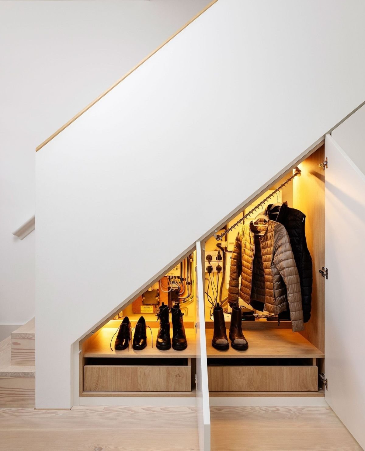 Maximize Space with Under-Stairs Coat Storage