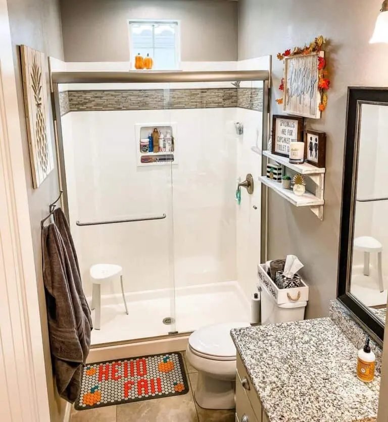 Orange Accents in Brown Bathroom
