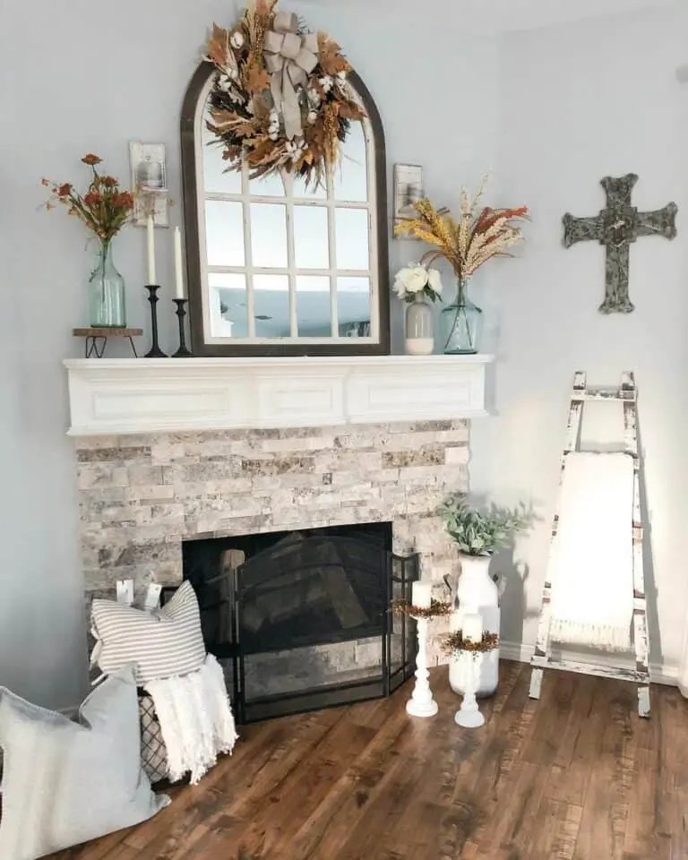 White Candle Décor by Fireplace