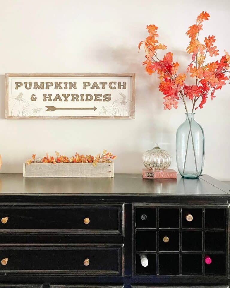 Black buffet with fall leaves
