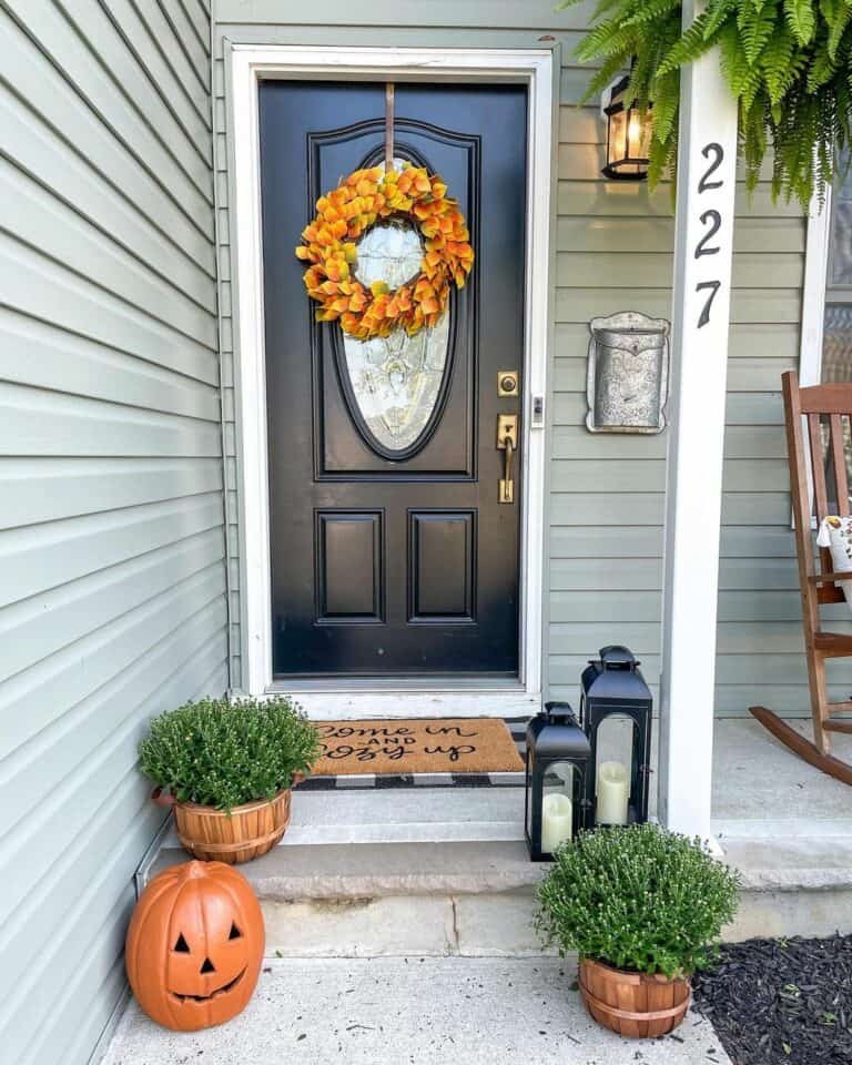 Black door with orange wreath