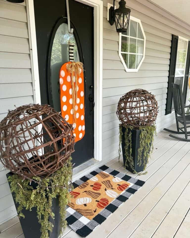 Black wall lamps and pumpkin decor