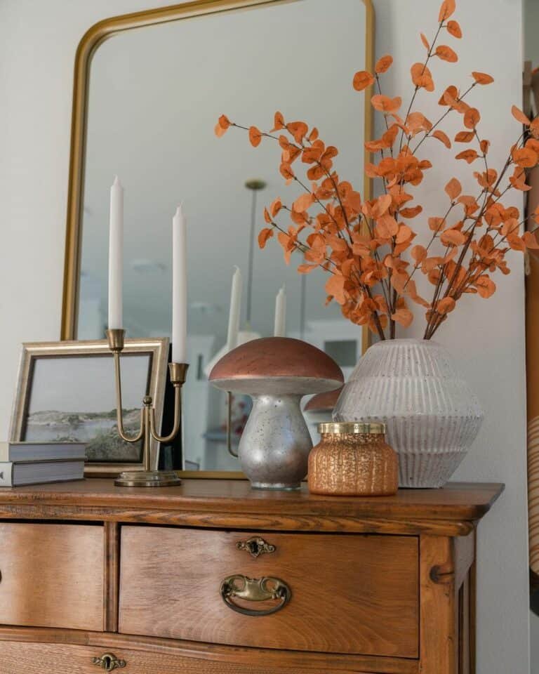 Brass accents enhance vintage dresser