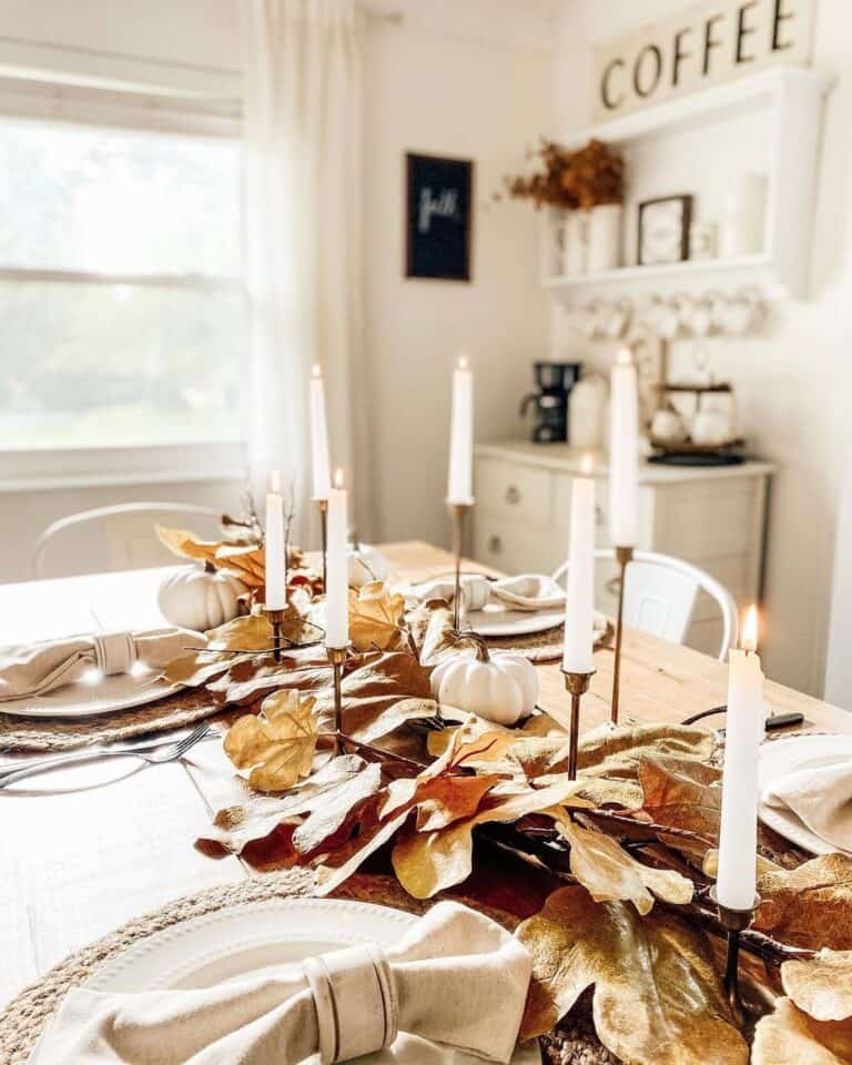 Brown leaves and white pumpkins