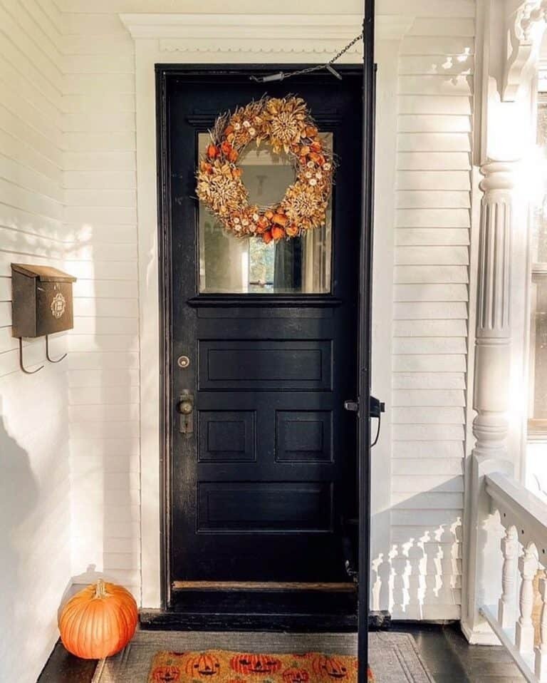 Brown orange wreath black door
