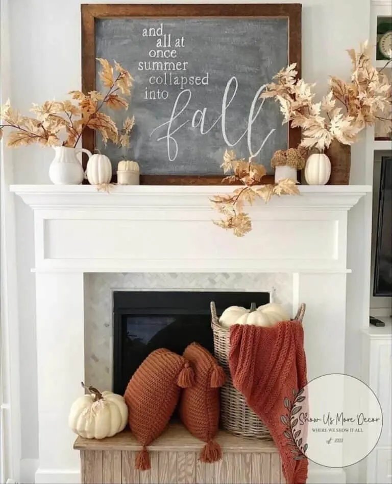 Chalkboard and pumpkins by fireplace