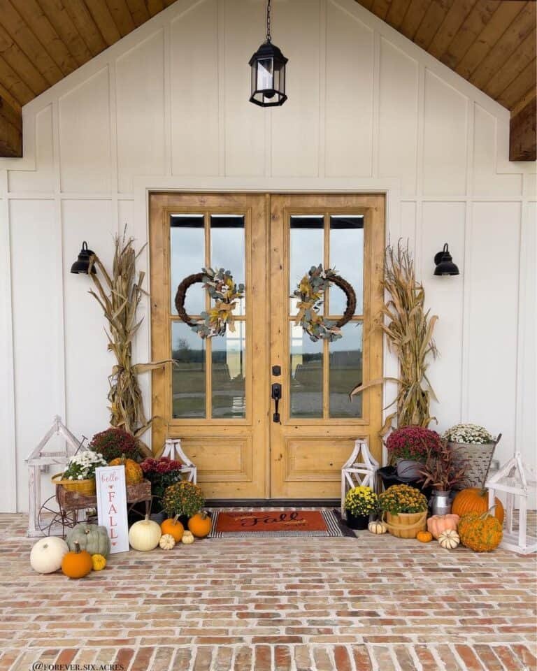 Double French doors with pumpkins and mums