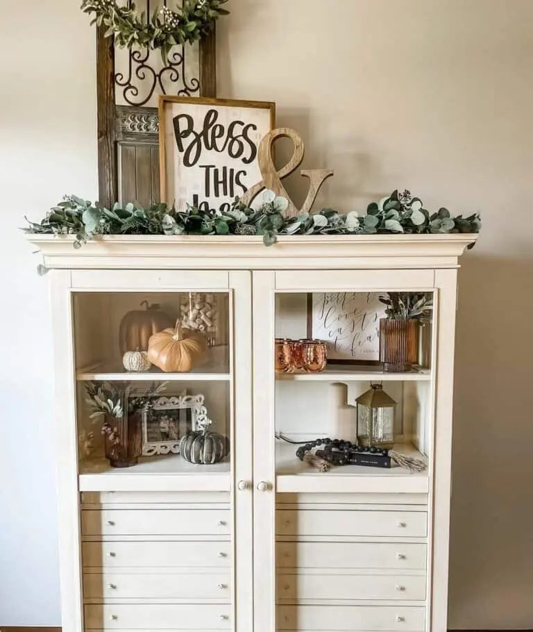 Fall-styled hutch with wood and garland