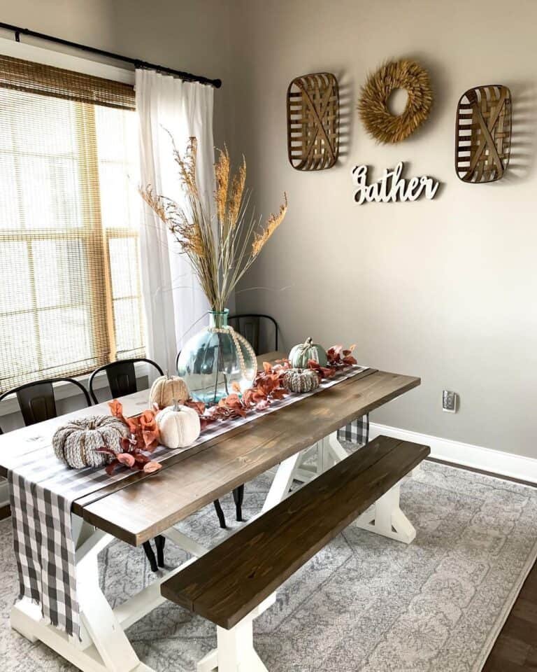 Farmhouse Table with Plaid Runner and Pumpkins