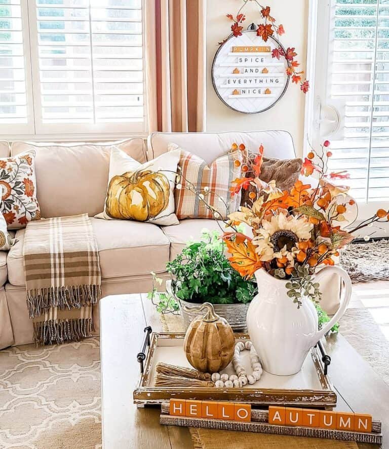 Floral pitcher with pumpkin centerpiece