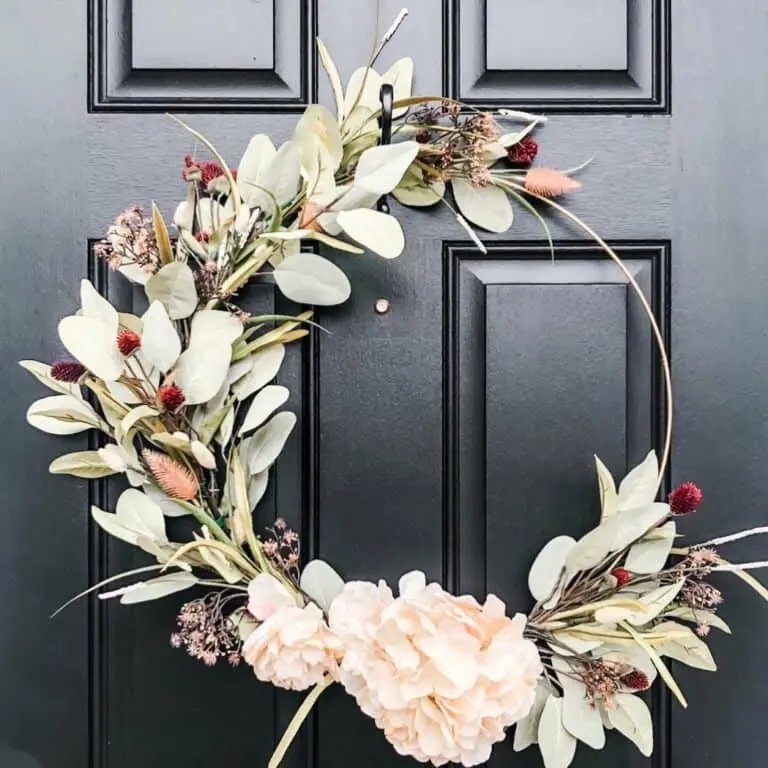 Gold hoop wreath on black door