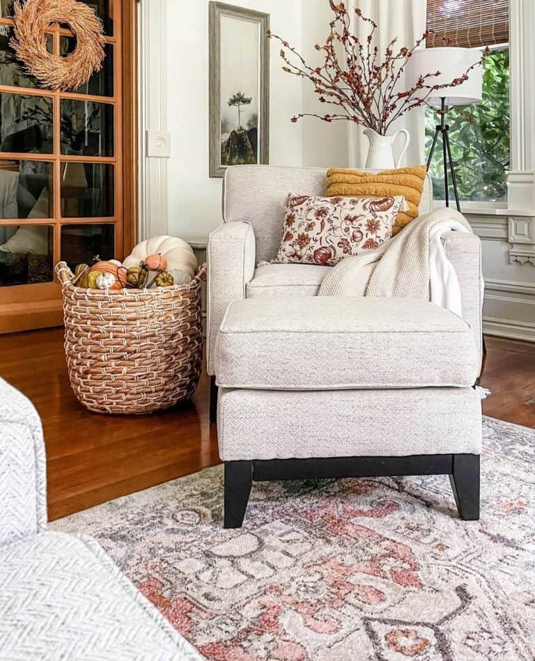 Gray armchair with pumpkin basket
