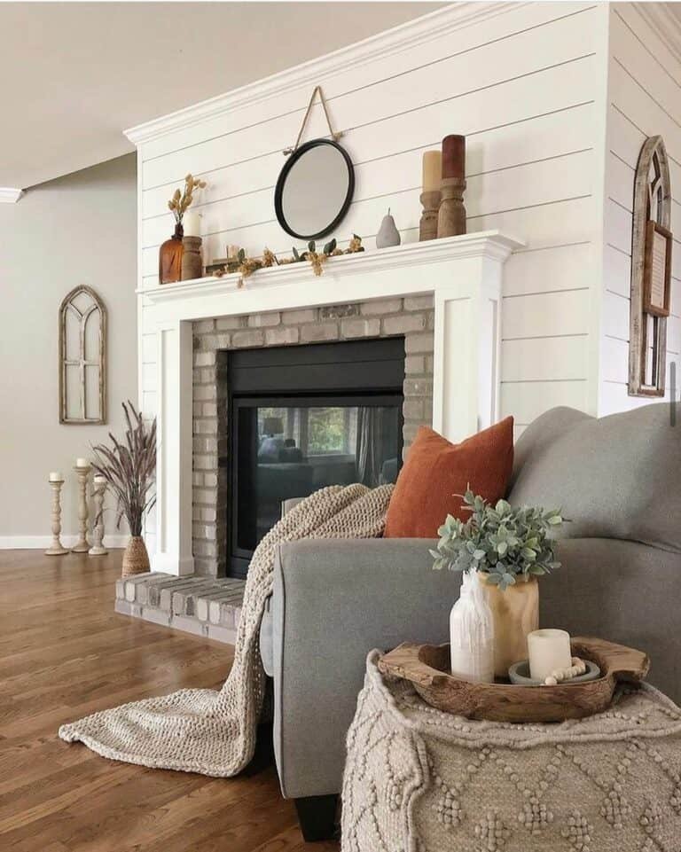 Gray brick fireplace with dried flowers