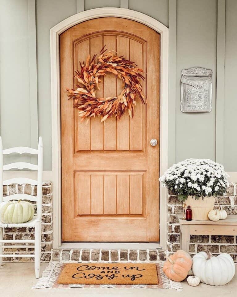 Natural Wood Door with Dried Leaf Wreath