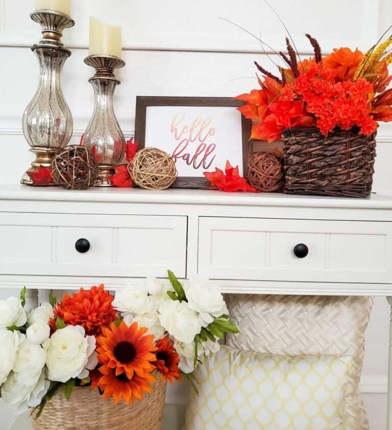Orange accents on white entryway