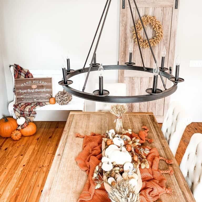 Orange and white pumpkins on wooden table