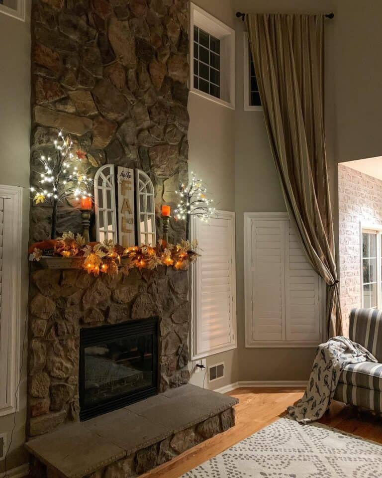 Orange leaf garland on stone fireplace