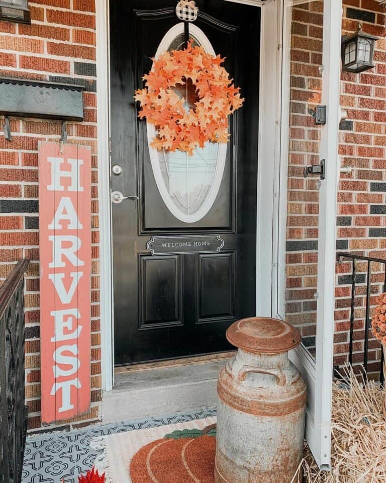 Orange leaf wreath on black door