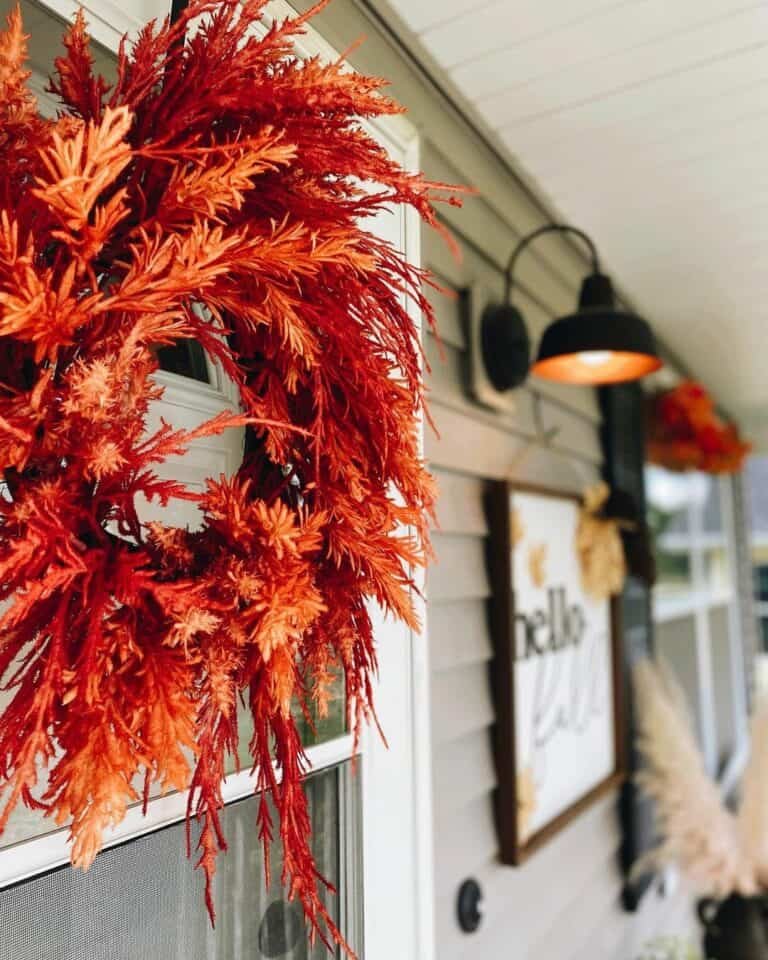 Orange wreath on white door