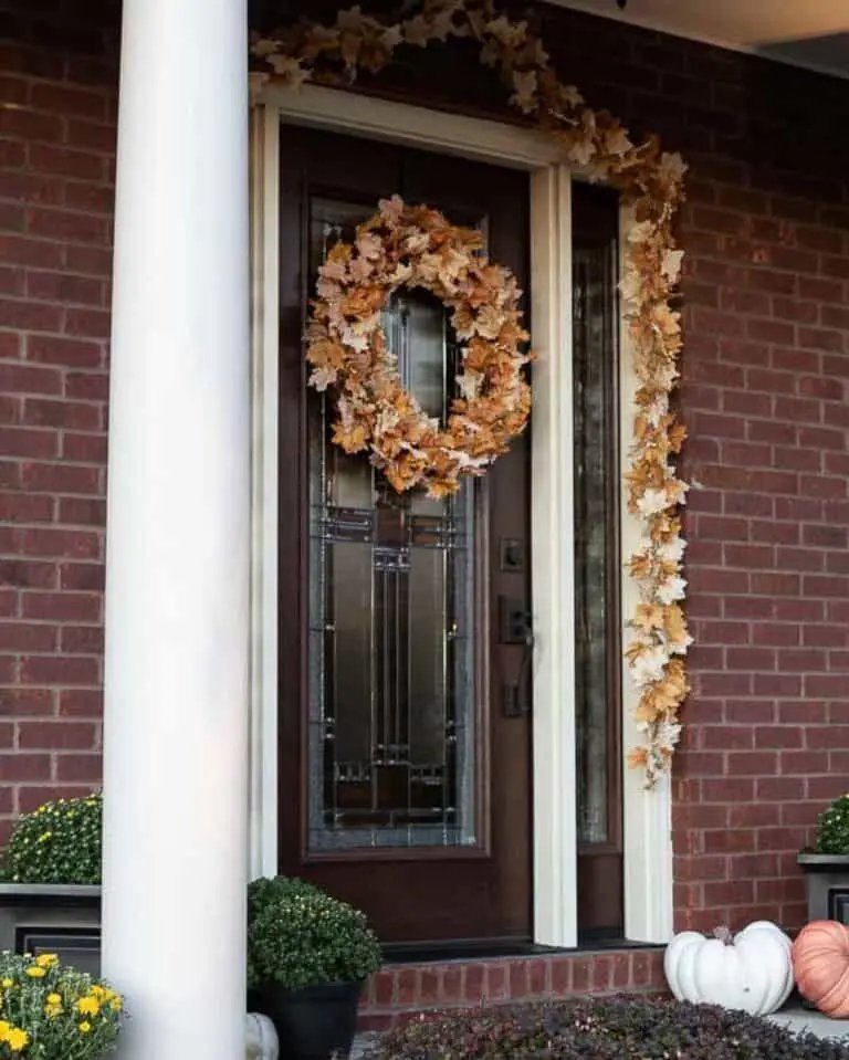 Red brick porch with fall leaves