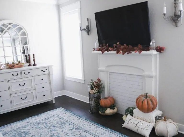Rug and Pumpkins by Mantel