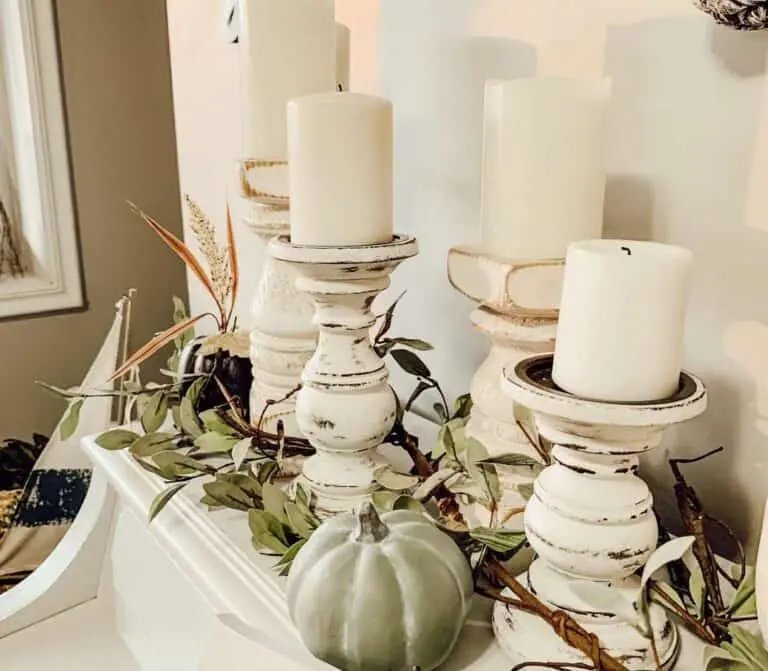 Rustic candle holders with greenery