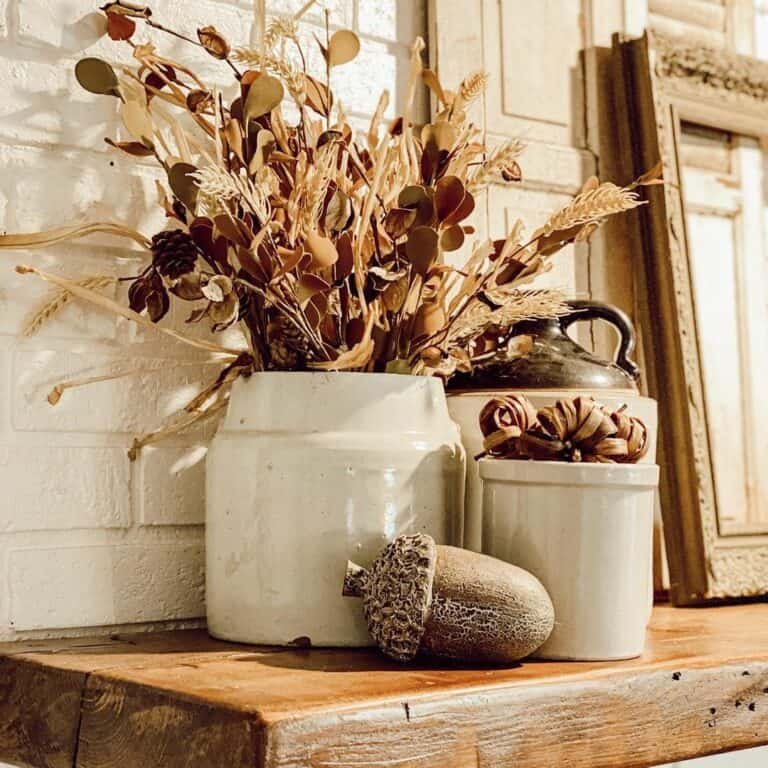 Rustic mantel with autumn planters