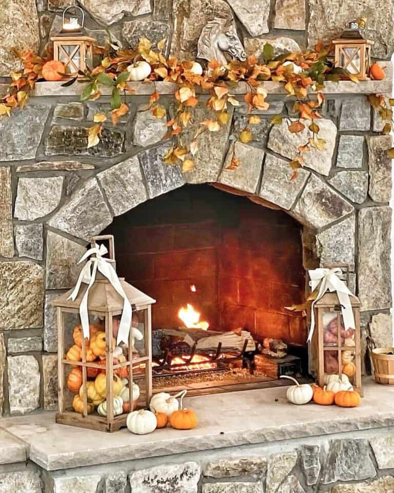 Rustic stone mantel with pumpkins and lanterns