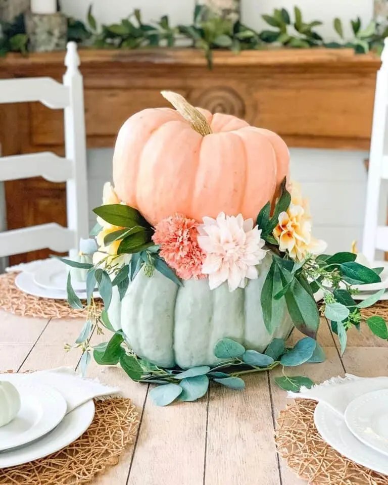 Stacked pumpkins with fall flowers