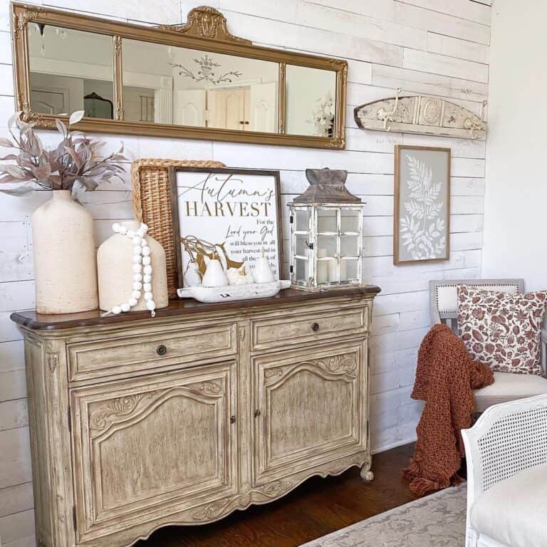 Vintage wood sideboard with fall decor