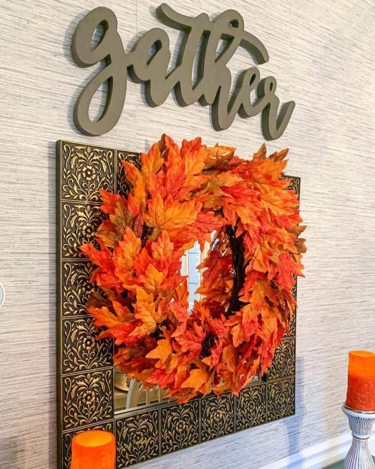 Vivid orange wreath with gold mirror