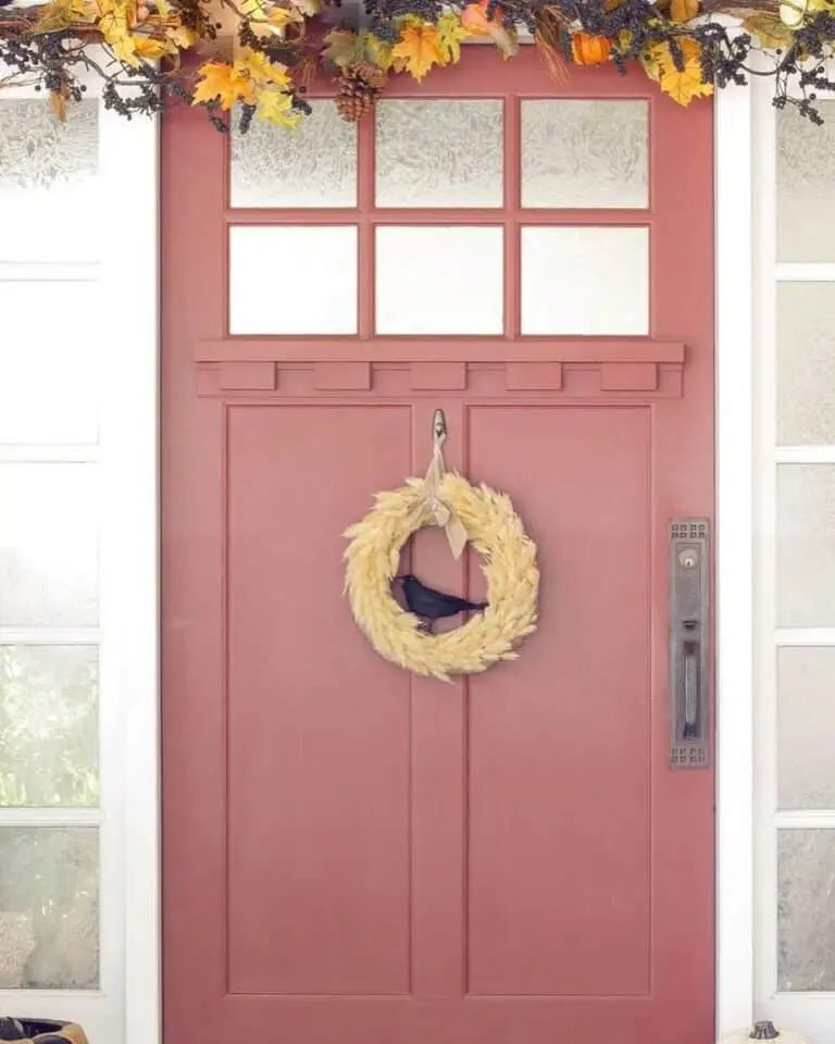Wheat wreath with crow and pinecones