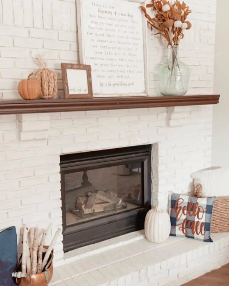 White Brick Fireplace with Pumpkins