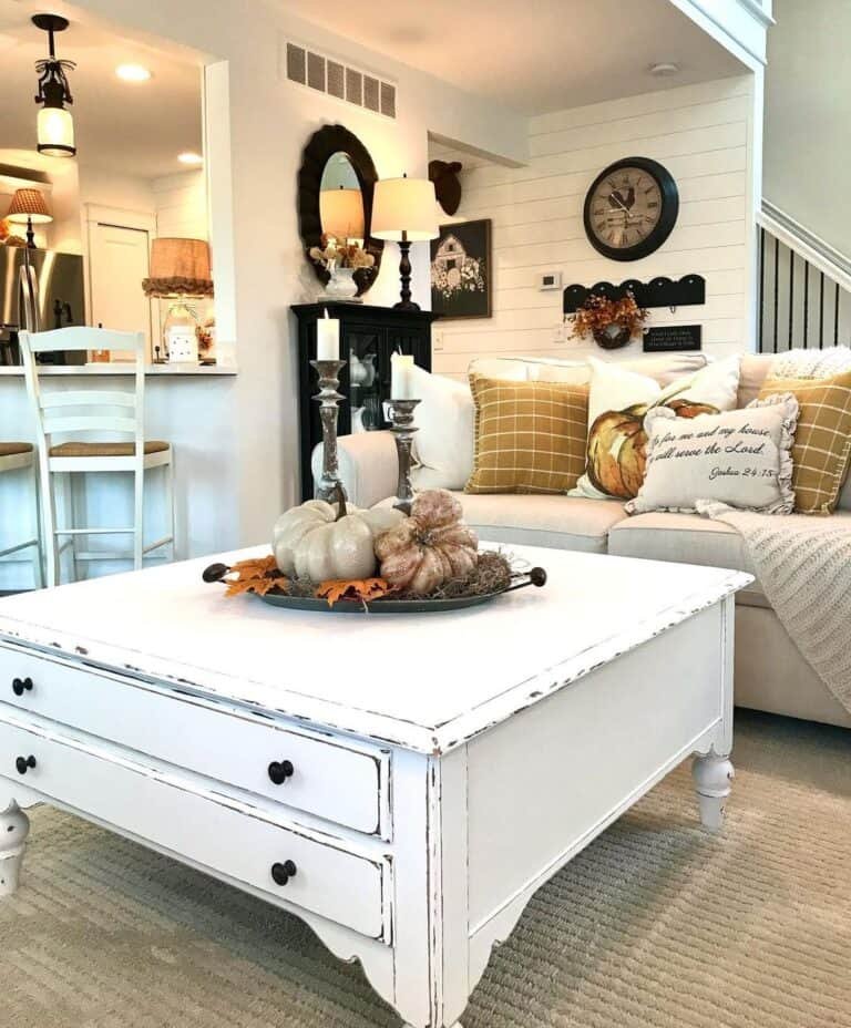 White coffee table with pumpkins