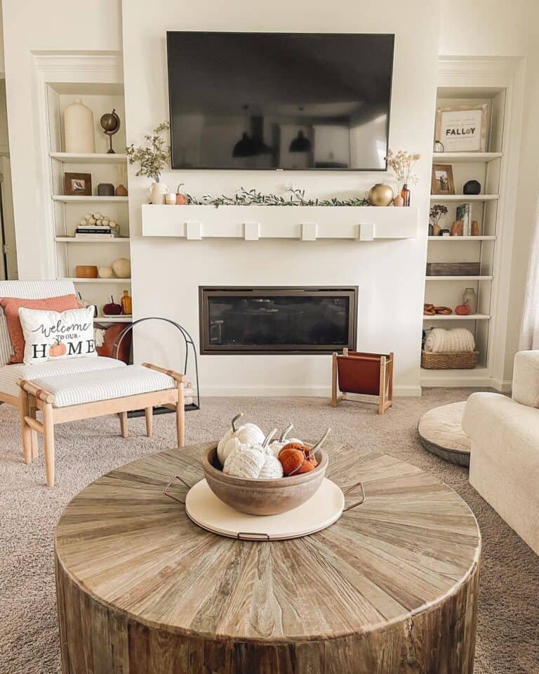 White drum table with pumpkins