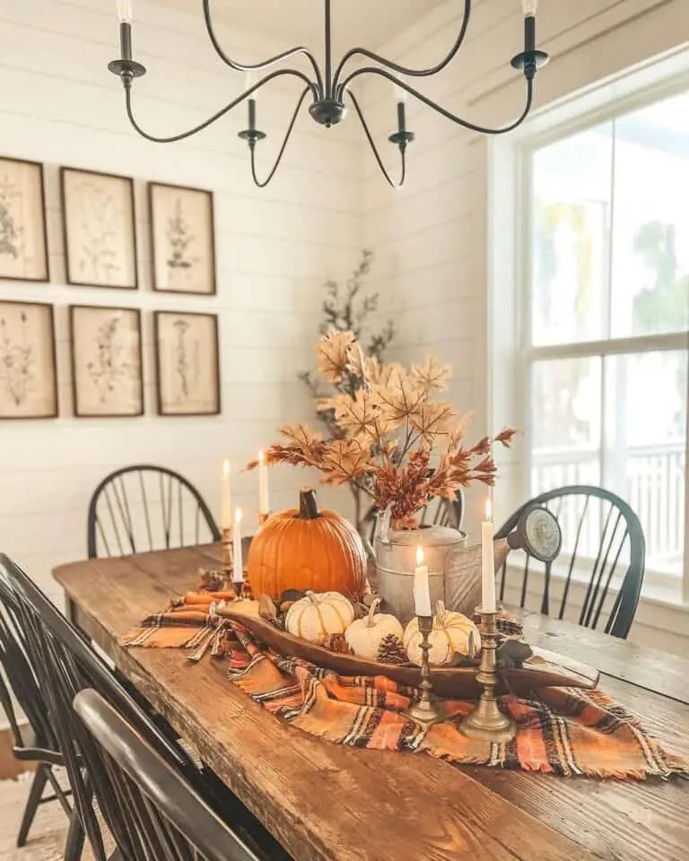 White shiplap dining room with rustic centerpiece