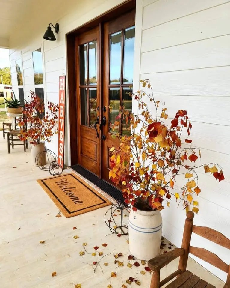 White Shiplap Porch with Iron Pumpkins