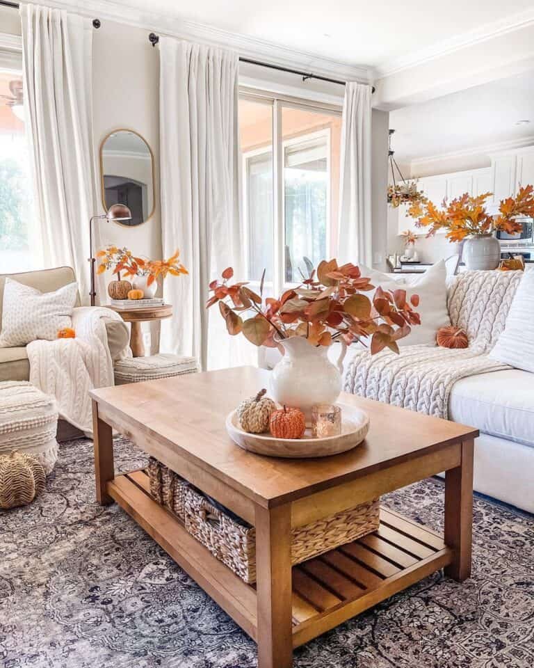 White vases with autumn leaves