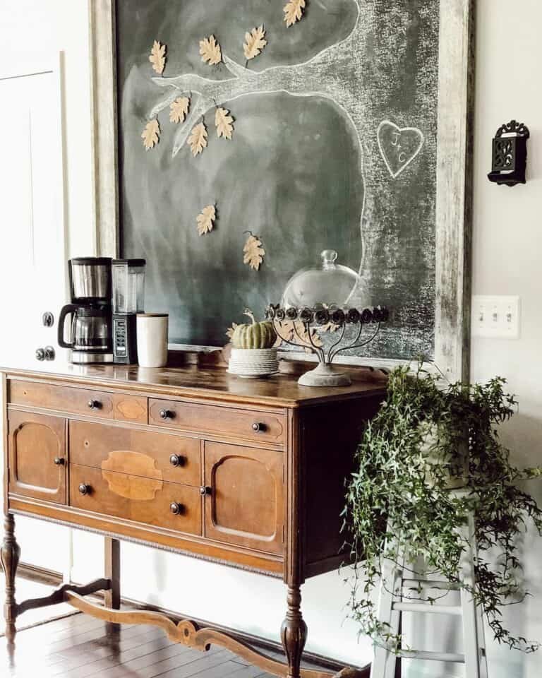 Wooden buffet with fall tree chalkboard