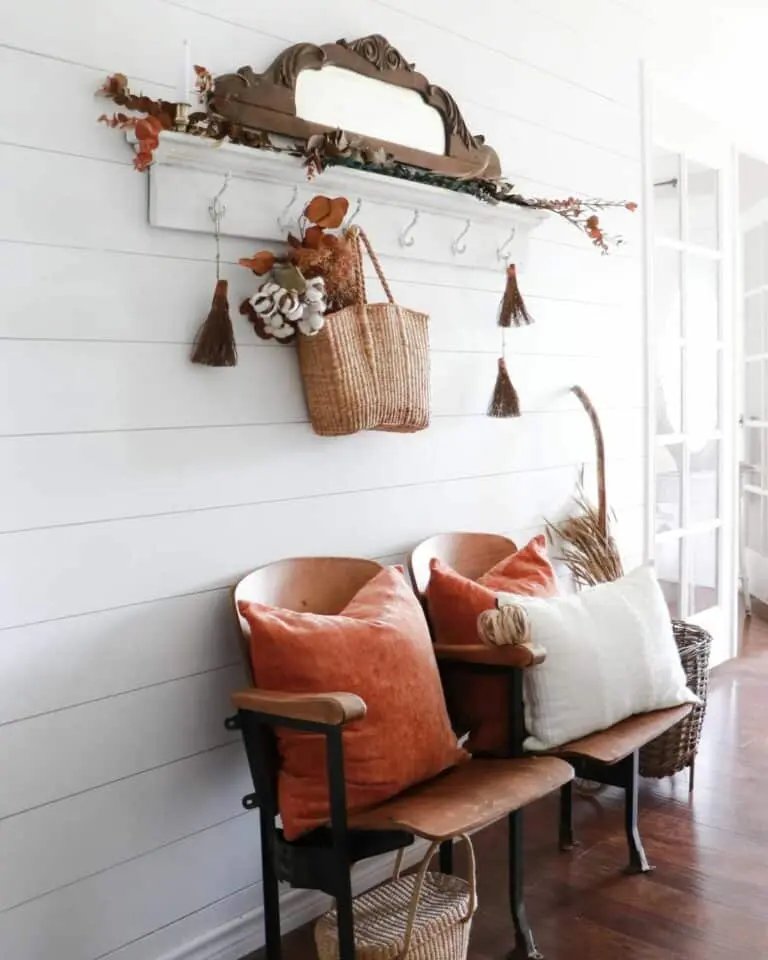 Wooden chairs with orange pillows