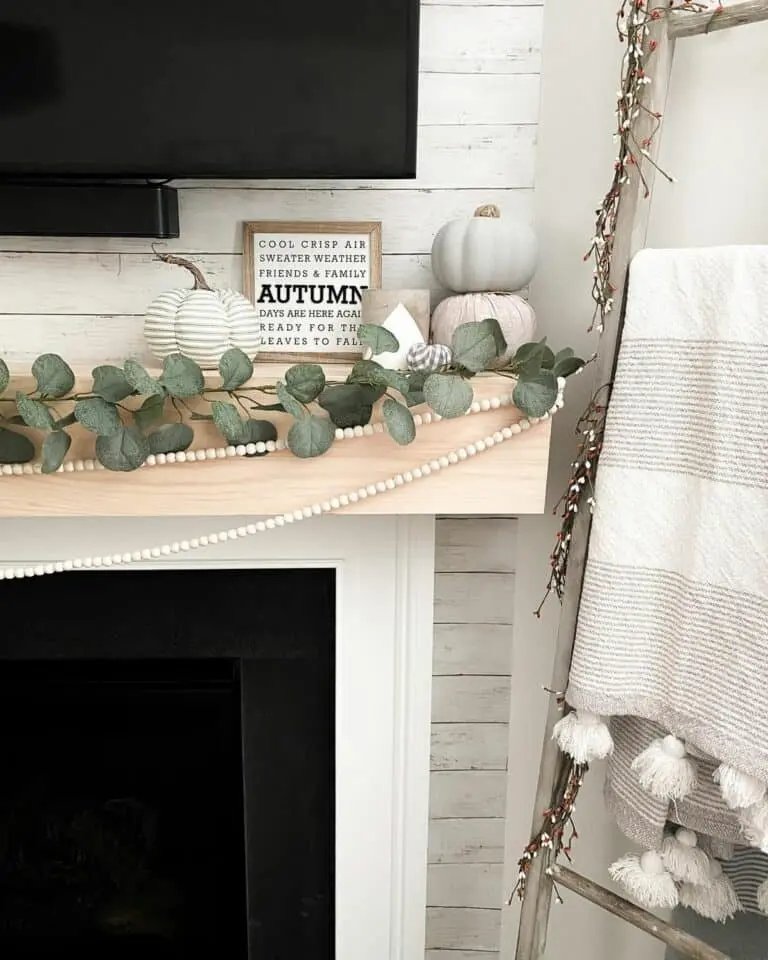 Wooden ladder with faux greenery
