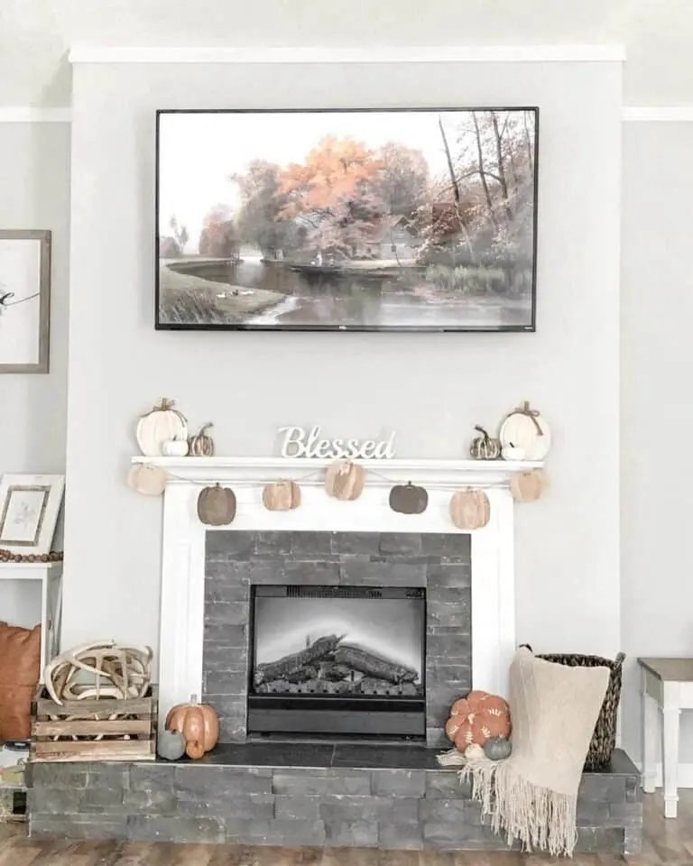 Wooden pumpkins on mantel